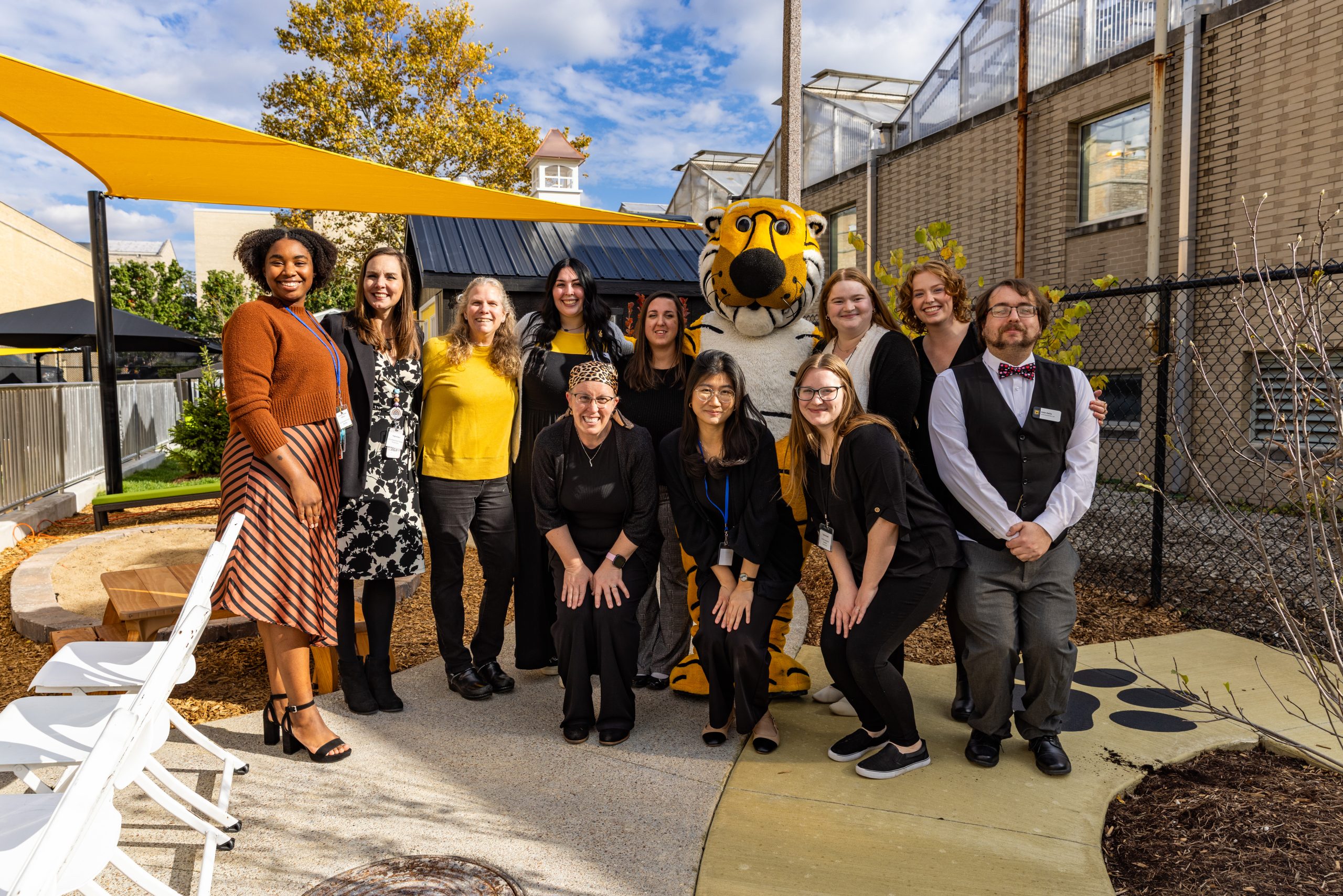 The staff of the Child Development Lab with Truman the Tiger.