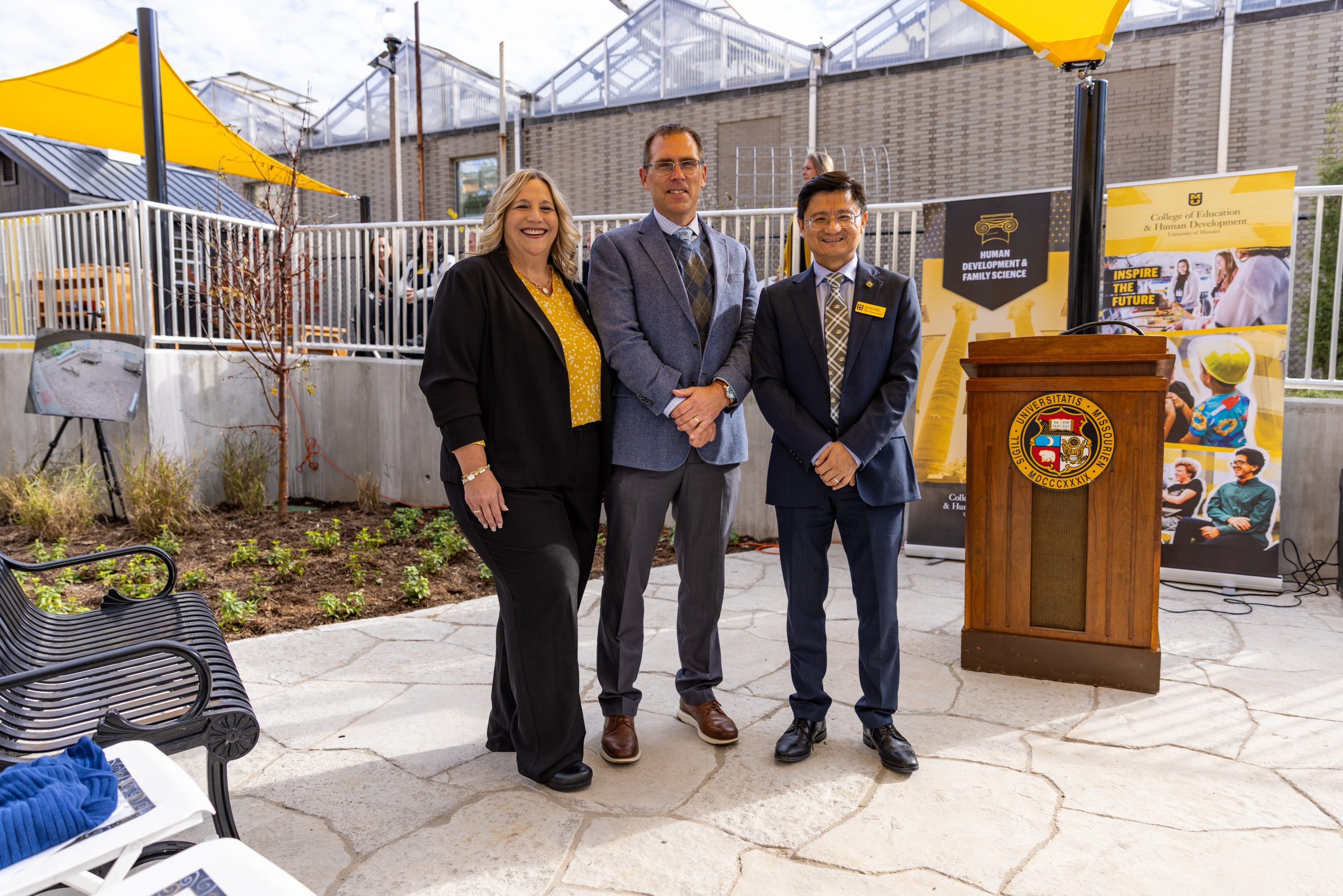 Brenda Lohman, Dean Kui Xie, Executive Vice Chancellor and Provost Matthew Martens.