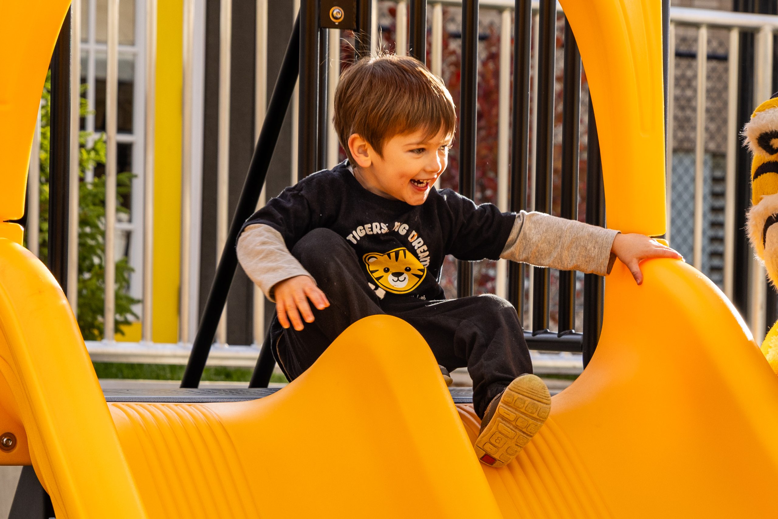 A child uses a new slide at the CDL.